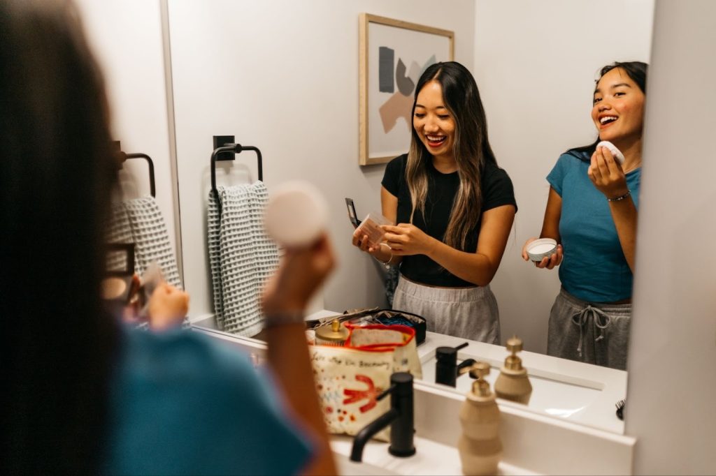 University of Michigan students get ready in their off-campus apartment in Ann Arbor.