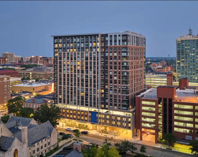 Nighttime view of The Legacy in downtown Ann Arbor.