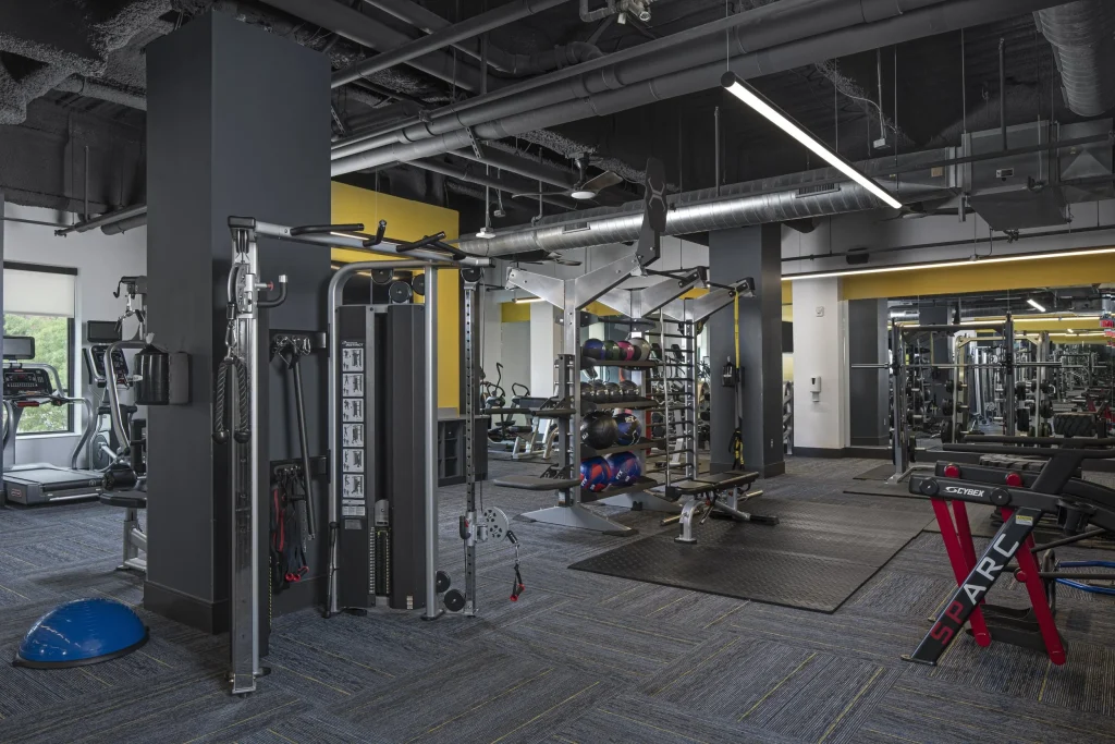 Vic Village North fitness center with strength machines, free weights and workout equipment in a student apartment community near the University of Michigan.