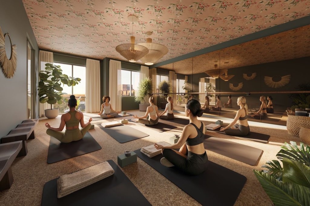 Rambler Ann Arbor yoga studio featuring a mirrored wall, natural light, cork flooring and wellness space near the University of Michigan campus.