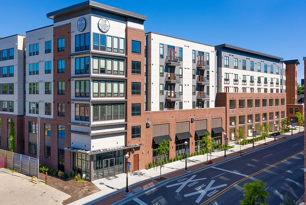 The Yard Ann Arbor student apartments near the University of Michigan, modern off-campus Ann Arbor student housing with retail storefronts and walkable downtown location.