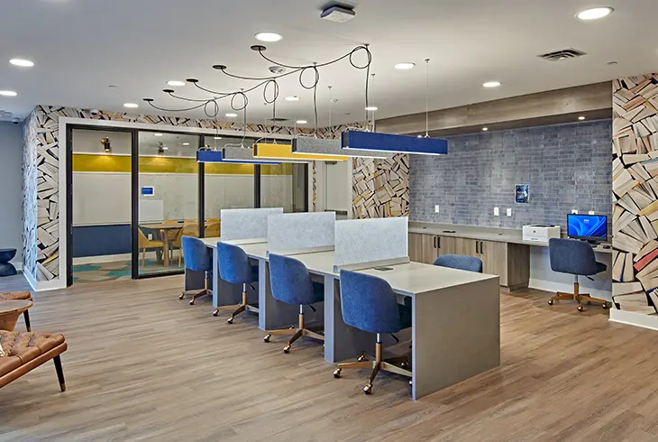 The Standard at Ann Arbor study lounge with modern co-working desks, private meeting rooms and contemporary finishes in luxury student apartments near the University of Michigan.