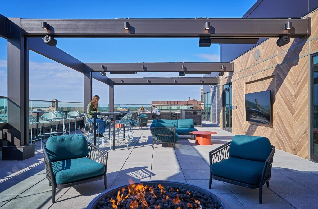 Vic Village South rooftop terrace with fire pit, outdoor seating and skyline views near the University of Michigan in Ann Arbor.
