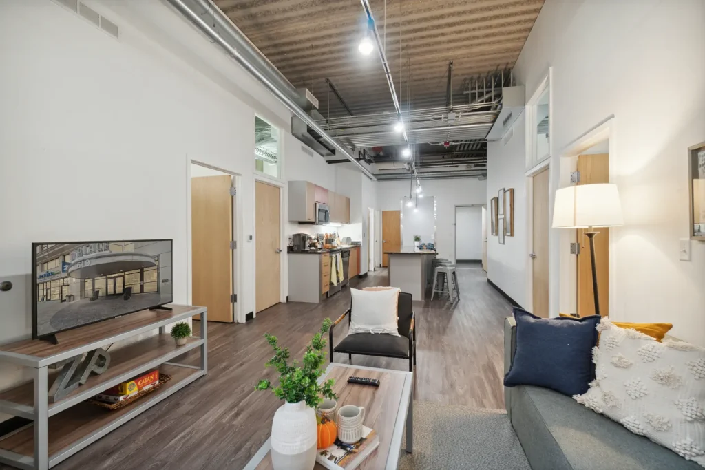 Z Place Ann Arbor apartments feature an open-concept living area and kitchen near the University of Michigan campus.
