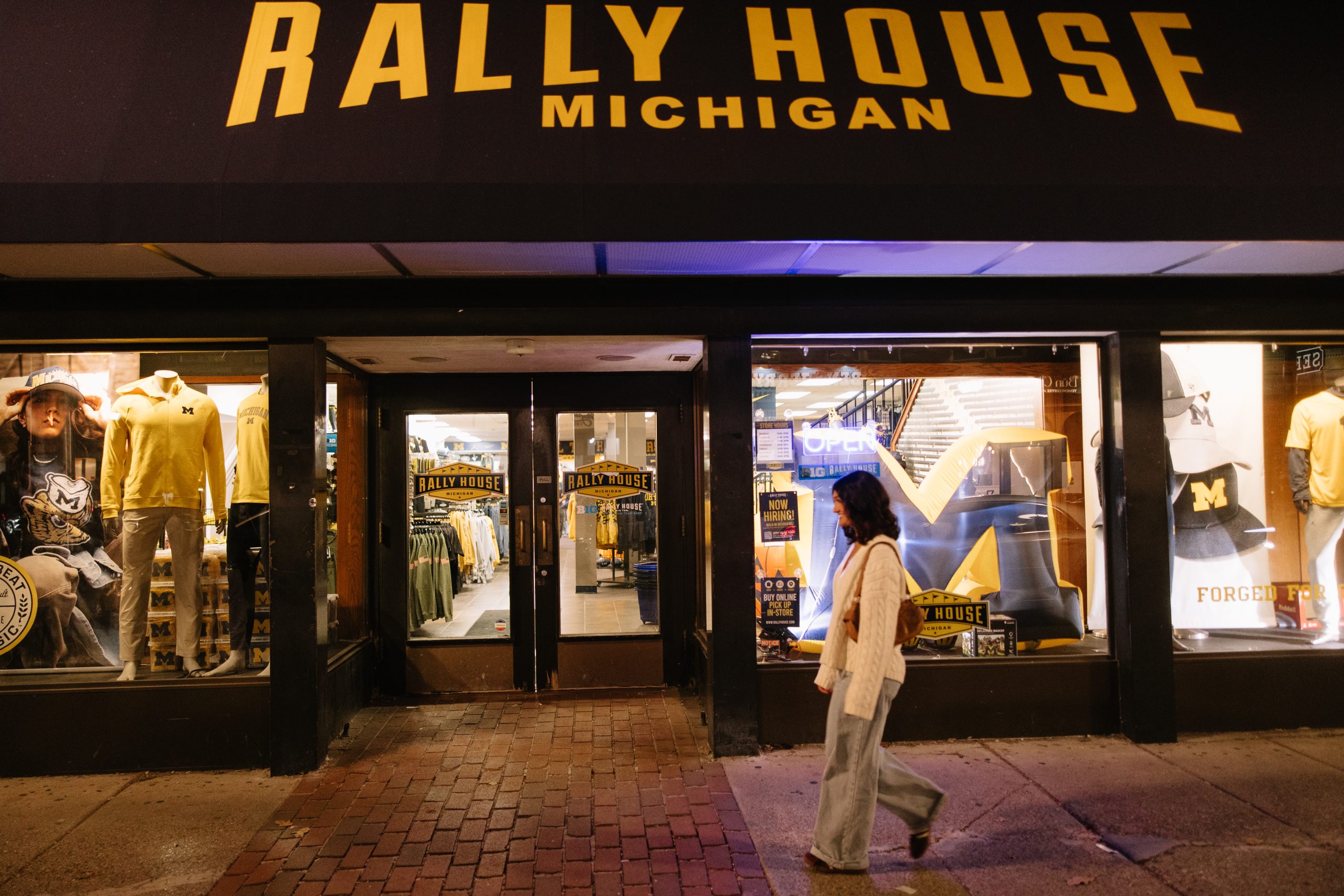 University of Michigan students walk off campus in front of Rally House in Ann Arbor.