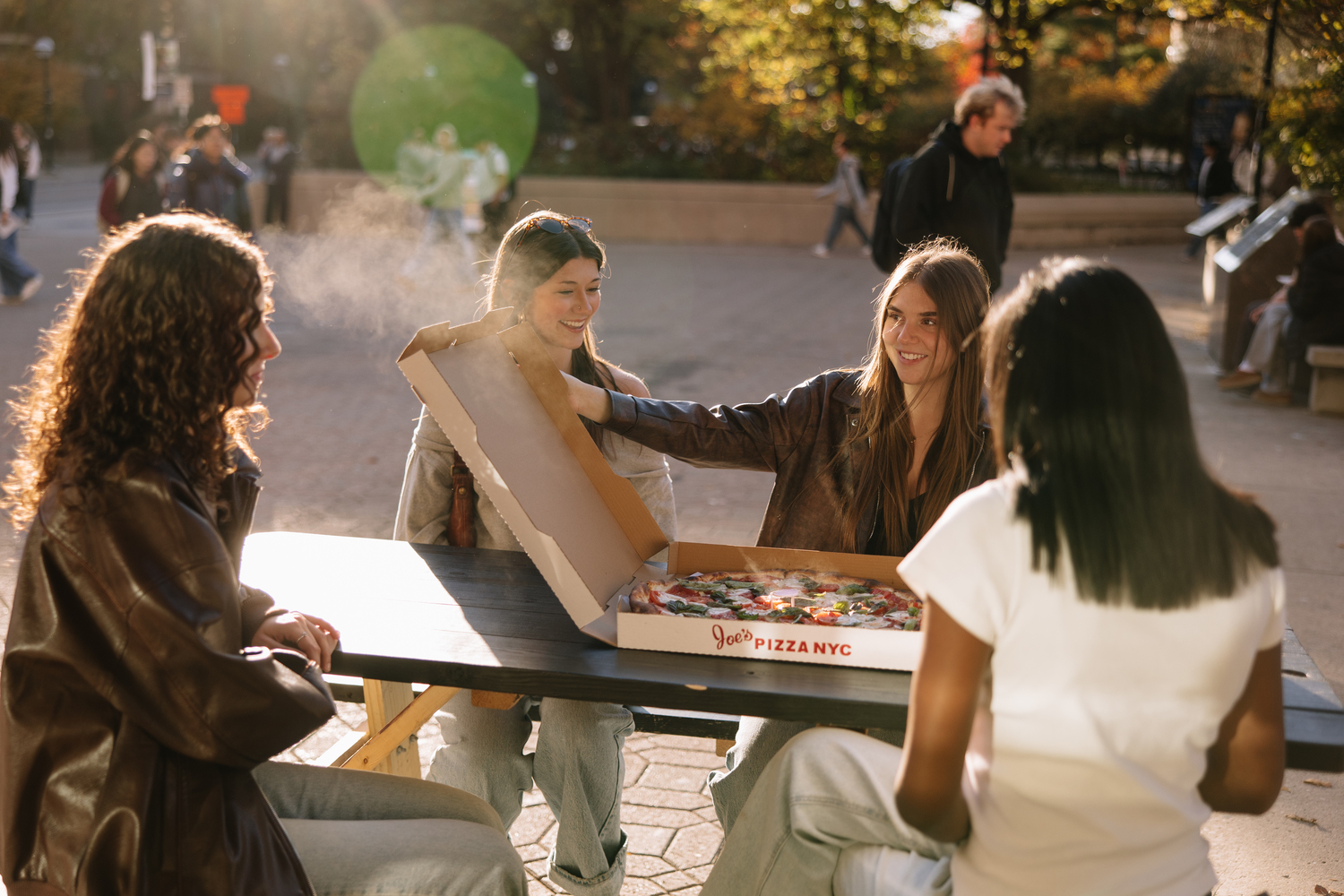 University of Michigan students enjoy pizza at a happy hour near campus in Ann Arbor. 