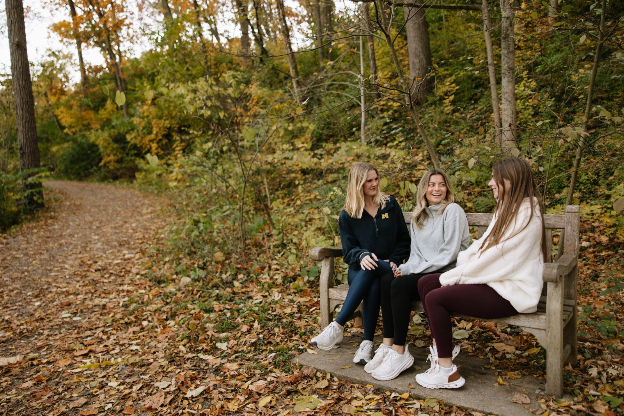 University of Michigan students spend time together outside in Ann Arbor. 