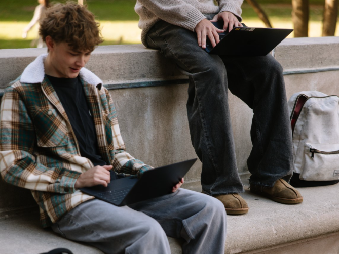 A UMich student studying in the Diag, located on Central Campus in Ann Arbor.