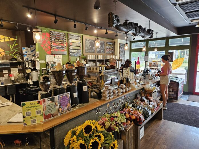 Interior of Argus Farm Stop in Ann Arbor with a coffee counter, baked goods and fresh flowers, a community café offering locally sourced options for brunch in Ann Arbor.