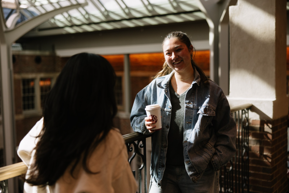 A UMich student drinking coffee in the Michigan Union, located on Central Campus.