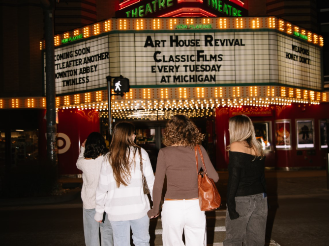 UMich students walking on State Street, located near Central Campus in Ann Arbor.