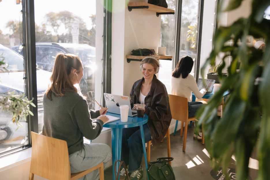 Two UMich students at a coffee shop in Ann Arbor near Central Campus.  