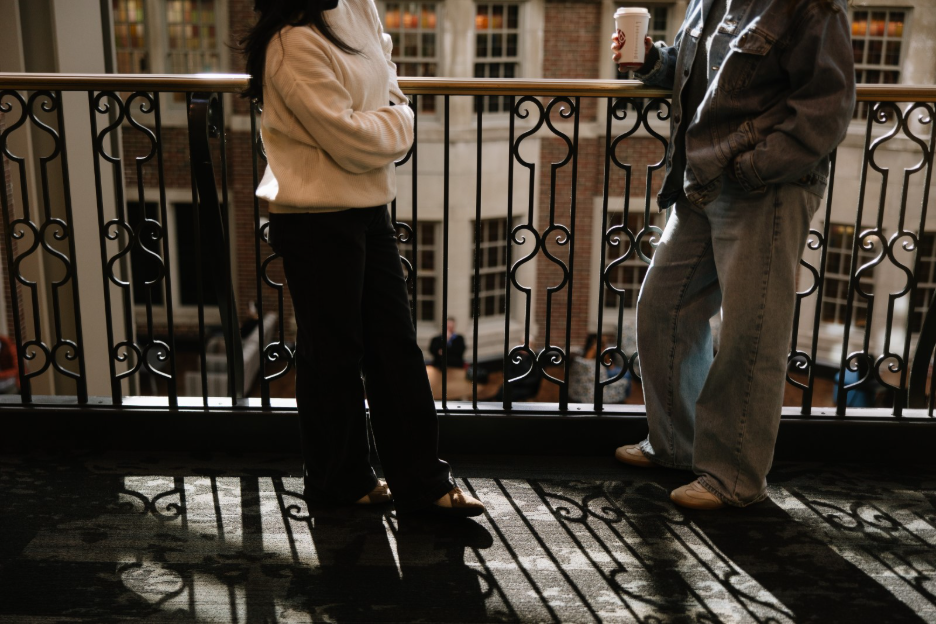 Two UMich students talking while drinking coffee in the Union, a building located on central campus in Ann Arbor. 