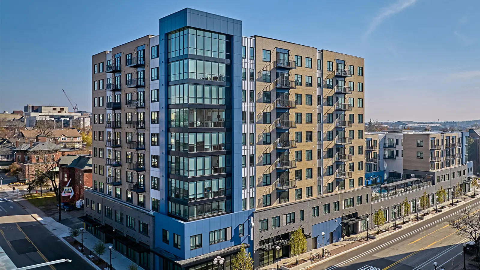 The Standard at Ann Arbor high-rise student apartments on Main Street, featuring modern balconies and luxury Ann Arbor student housing near the University of Michigan campus.