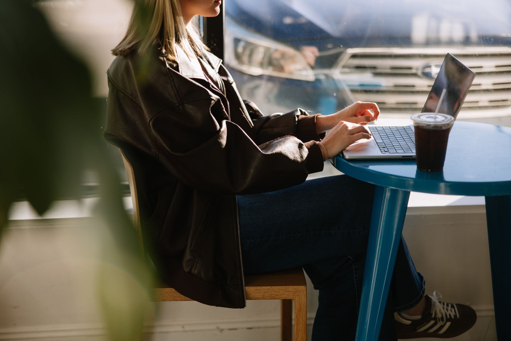 A University of Michigan student studies on a laptop at an off-campus coffee shop in Ann Arbor.