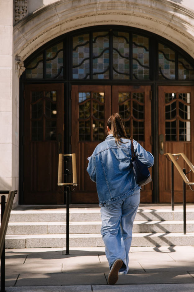 A UMich student walking into the Michigan Union, located on Central Campus in Ann Arbor.