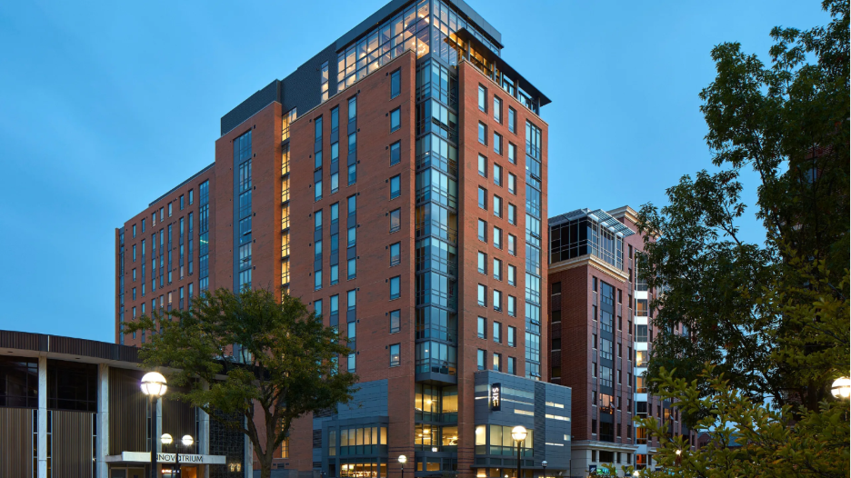Exterior photo of Six11 student apartments in Ann Arbor.