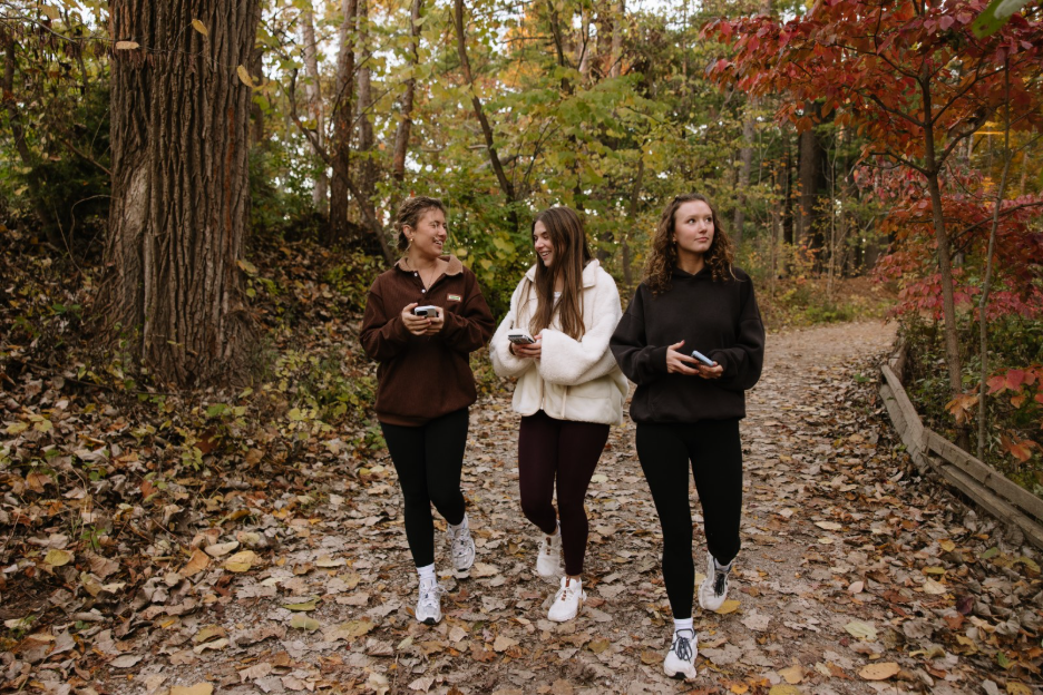 Three University of Michigan students walking through the Nicholas Arboretum, a nature reserve located right off the Hill in Ann Arbor.