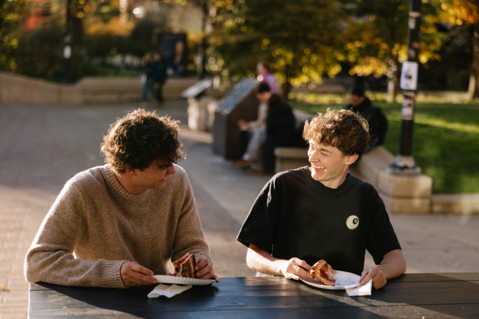 Two UMich students eating at Joe’s Pizza, a favorite Ann Arbor restaurant located by the Diag.  