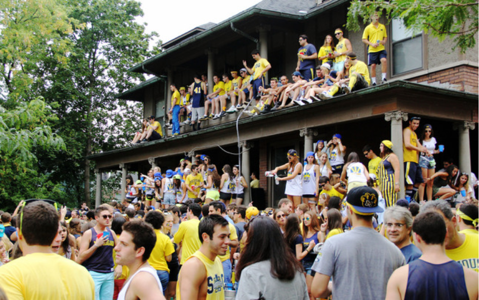 University of Michigan students enjoy an extended tailgate before the Notre Dame night game at a fraternity off campus.  