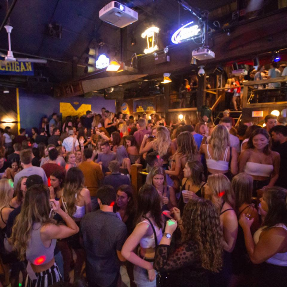 Students inside Scorekeepers Bar & Grill on Maynard Street in Ann Arbor. 