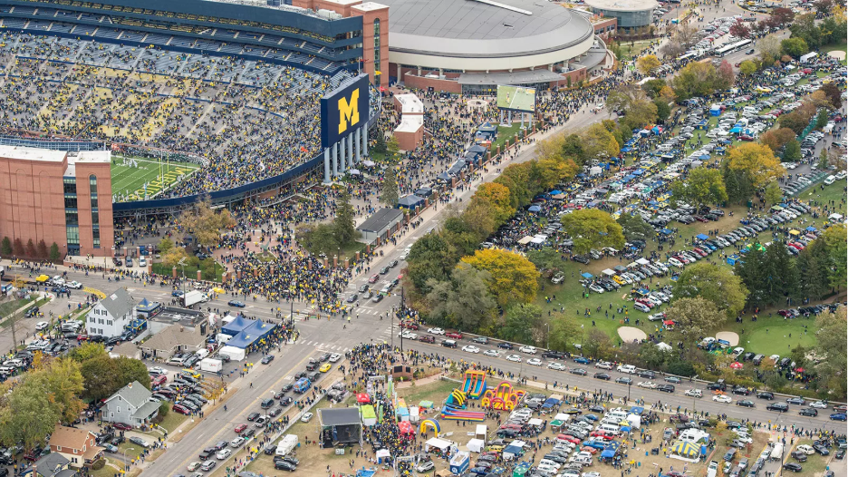 Michigan fans walking through downtown Ann Arbor on game day. 