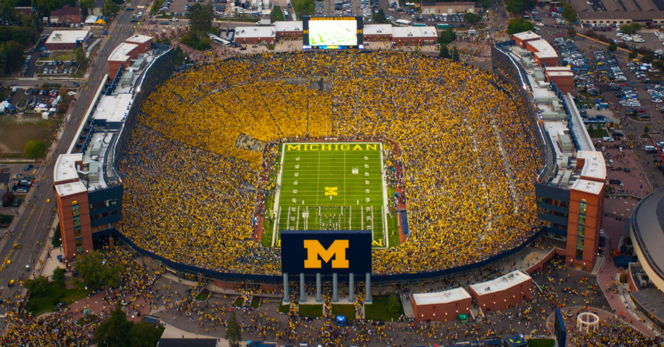 University of Michigan students and fans participating in a Maize out inside the Michigan Stadium during a football game.