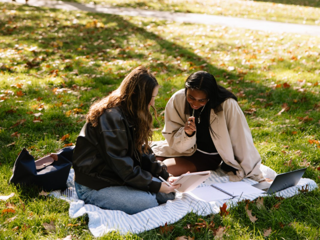 Two UMich students studying in the Law Quad near Central Campus in Ann Arbor.