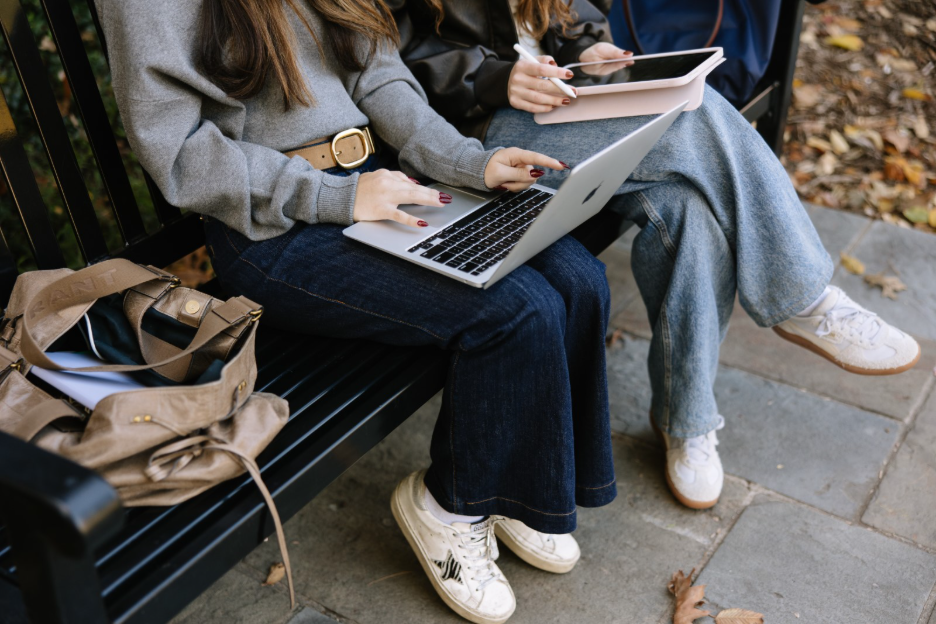 The University of Michigan students do work on a laptop in Ann Arbor.