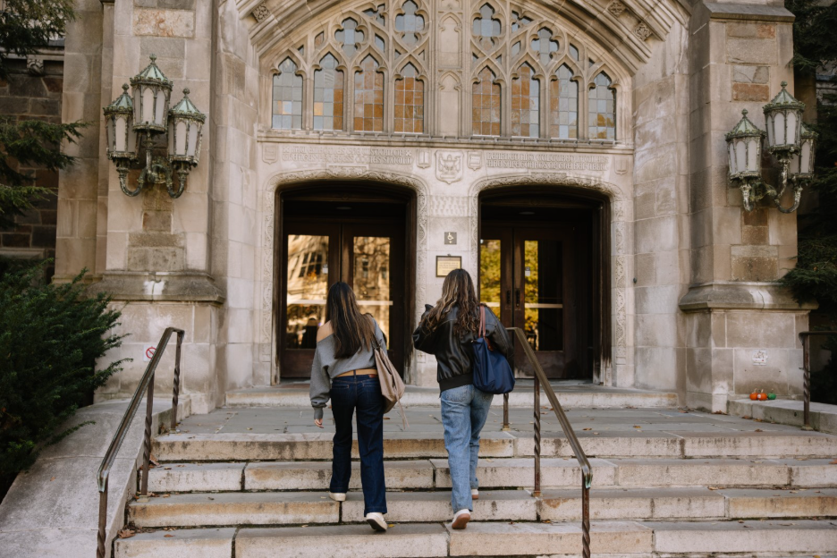 Two Michigan students walking into the Law Library in Ann Arbor. 